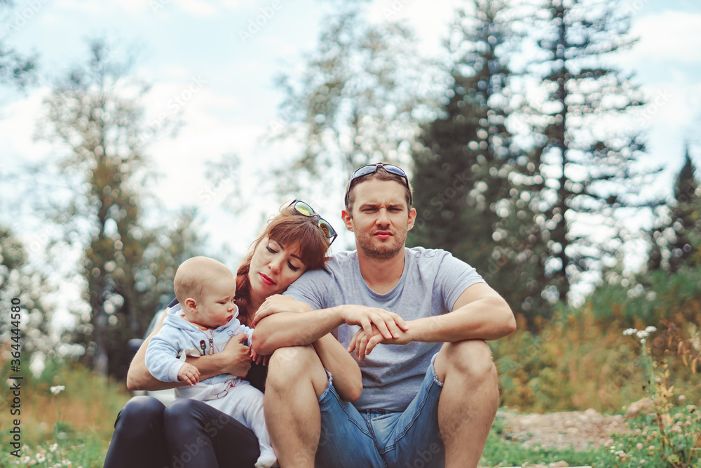 Fototapeta premium family with children sitting on the river Bank