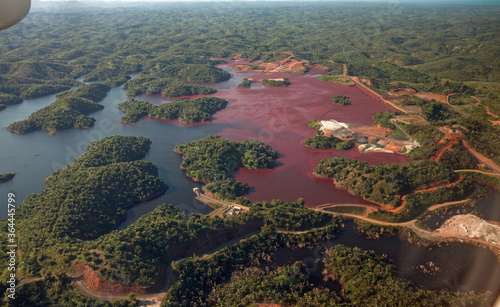 Mine tailings reservoir in Africa, receiving slurry through a pipeline from an ore processing plant.