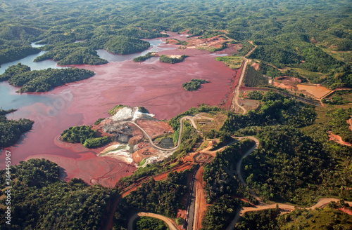 Mine tailings reservoir in Africa, receiving slurry through a pipeline from an ore processing plant. photo