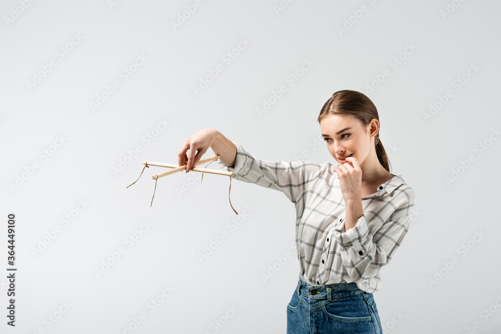 smiling attractive female puppeteer isolated on grey smiling attractive female puppeteer isolated on grey