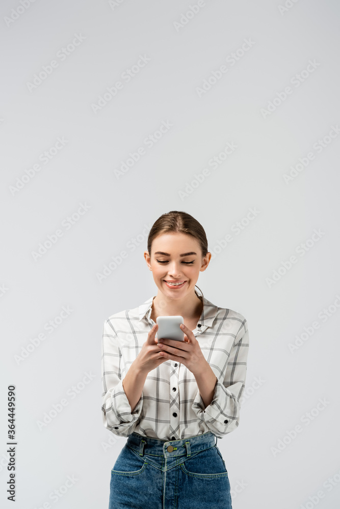 attractive girl using smartphone isolated on grey attractive girl using smartphone isolated on grey