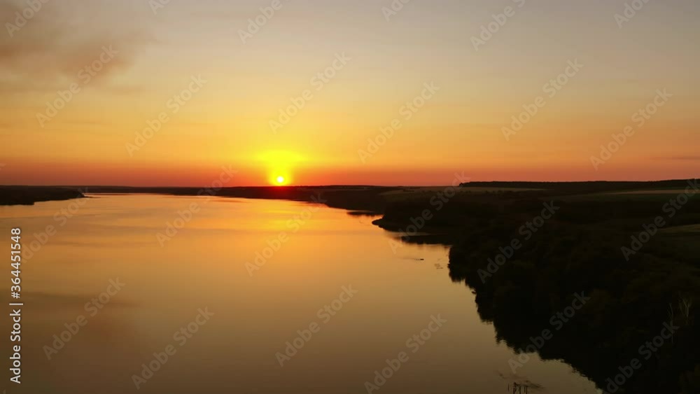 Rural river landscape. River view during colorful sunset Rural river landscape. River view during colorful sunset