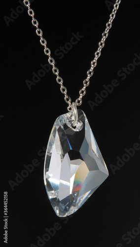 Pendant from one large glass crystal on a chain. 