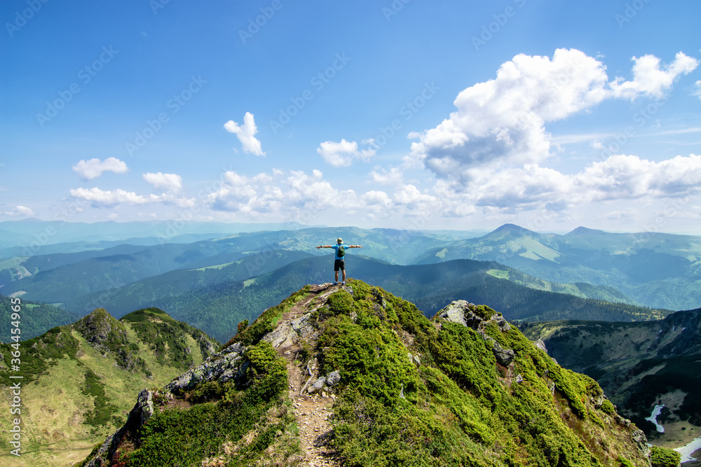 Man on top of mountain. Conceptual design. At the top of the mountain in the Ukrainian Carpathians, Marmarosh ridge