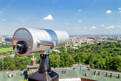 Tourist telescope for landscape exploring in Krakow (Cracow) from Kopiec Kosciuszki. Poland. Famous touristic attraction.