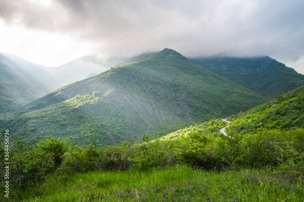 Fototapeta premium Picturesque view, rain clouds in mountains