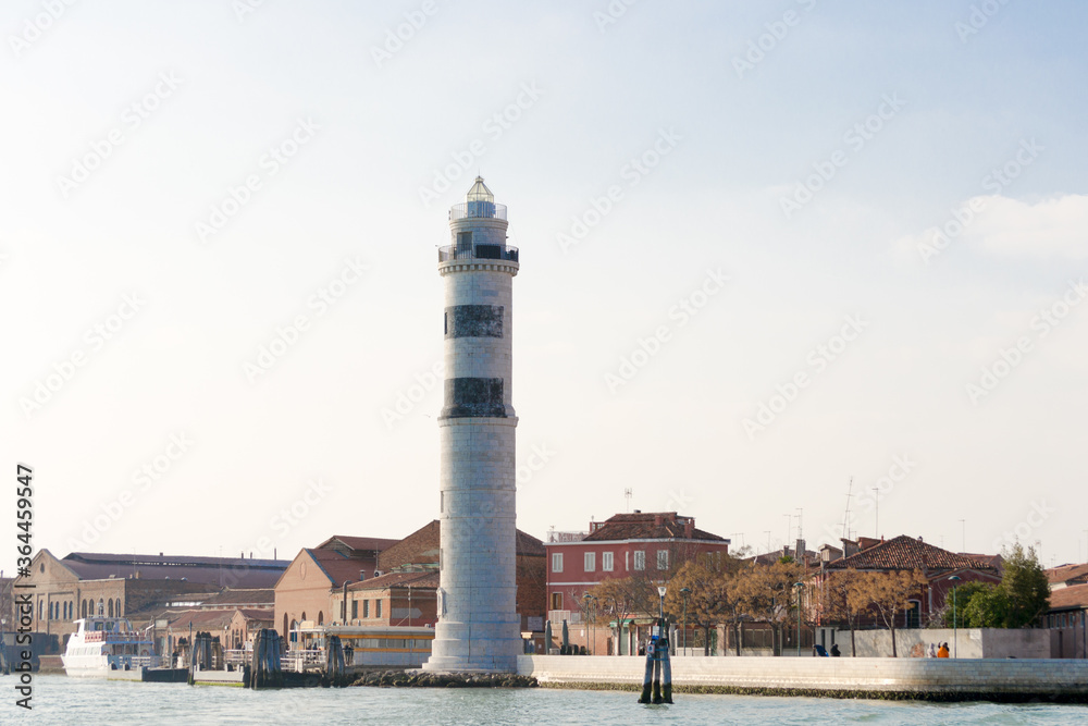 The beautiful lighthouse of Murano, the island in Venice lagoon famous for the glass production.From time to time there has always been a lighthouse here, this new one is made of white istria stone
