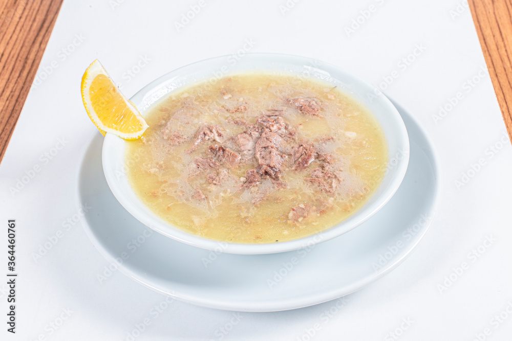 Turkish Traditional Soup with bread on white rustic wooden background, kelle, paca corbasi. Turkish Traditional Soup with bread on white rustic wooden background, kelle, paca corbasi.