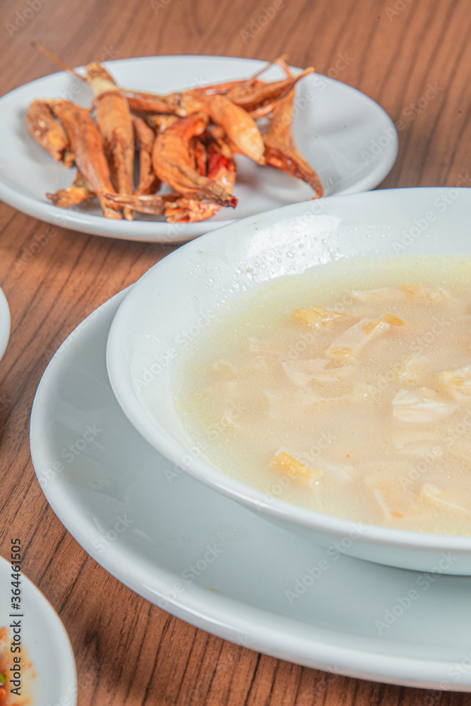 Turkish Traditional Soup with bread on white rustic wooden background, iskembe corbasi. Turkish Traditional Soup with bread on white rustic wooden background, iskembe corbasi.