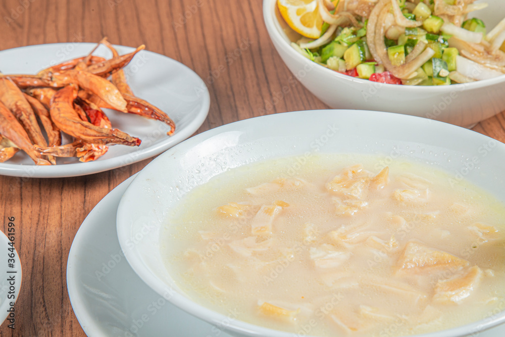 Turkish Traditional Soup with bread on white rustic wooden background, iskembe corbasi. Turkish Traditional Soup with bread on white rustic wooden background, iskembe corbasi.