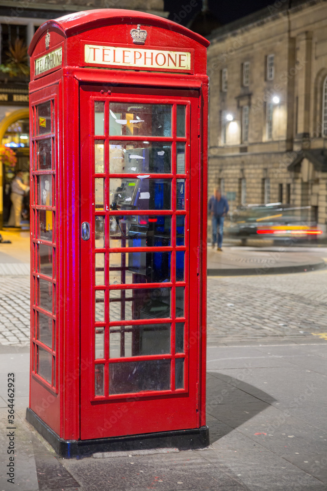 Classic red British telephone box, night scene Classic red British telephone box, night scene