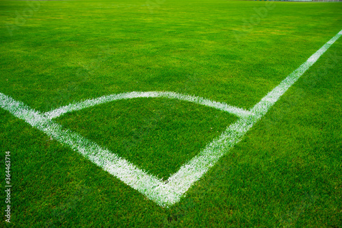 place for a corner kick on a green football field in summer. football in summer