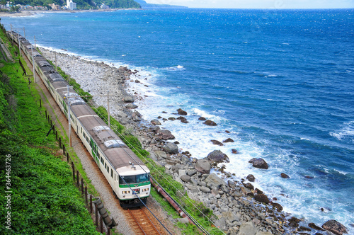 伊豆の列車　Train traveling in beautiful scenery photo