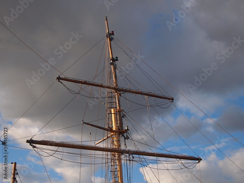 sail boat mast against stormy sky