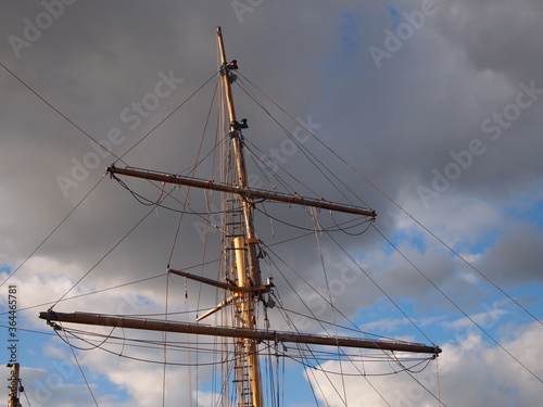 sail boat mast against stormy sky