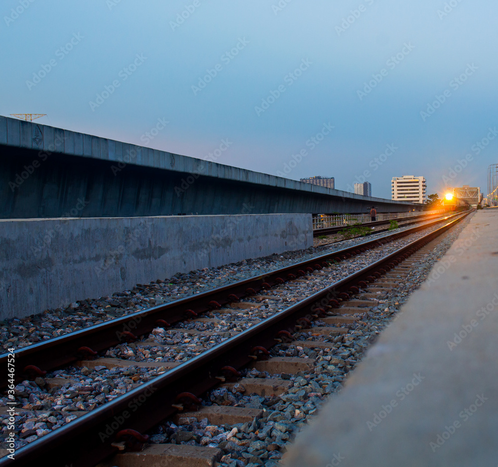 Railroad tracks and the orange light of the sunset Railroad tracks and the orange light of the sunset
