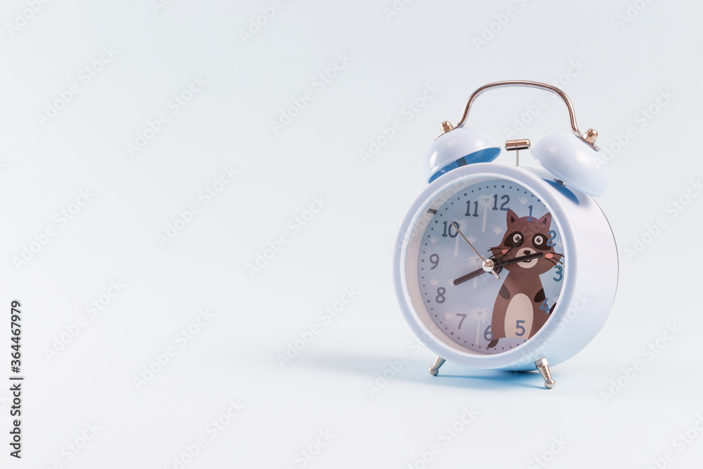 Alarm clock on blue background Alarm clock on blue background