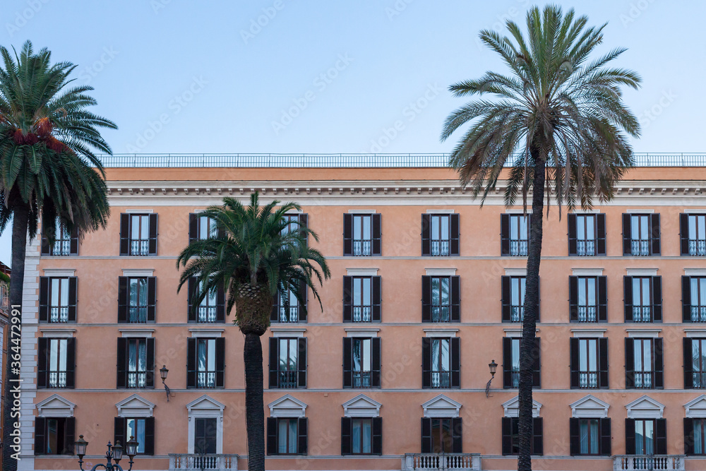 ROME, ITALY - 2014 AUGUST 18. Big building with green palms in Rome.