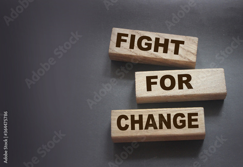 Fight for change wooden blocks. Racial unequality, Stop discrimination concept photo