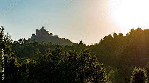 sunset with medieval castle © Jose