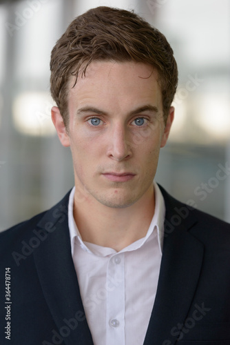 Face of young handsome businessman at the airport © Ranta Images