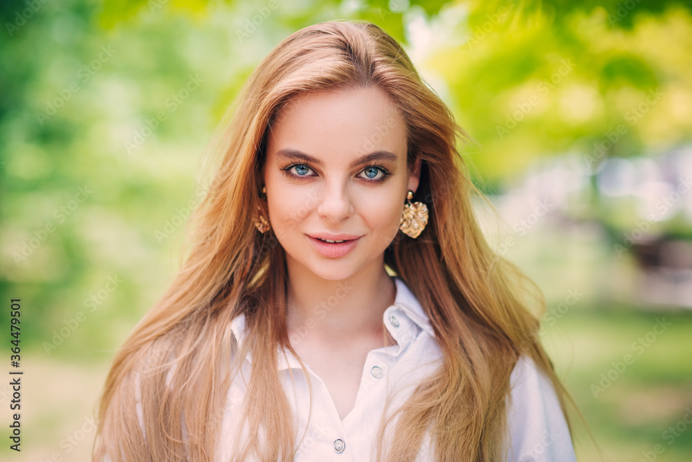 Beautiful girl is smiling. Sunny warm colors. Copyspace Beautiful girl is smiling. Sunny warm colors. Copyspace