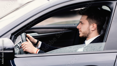 Focused business man driving alone in his new car © Prostock-studio