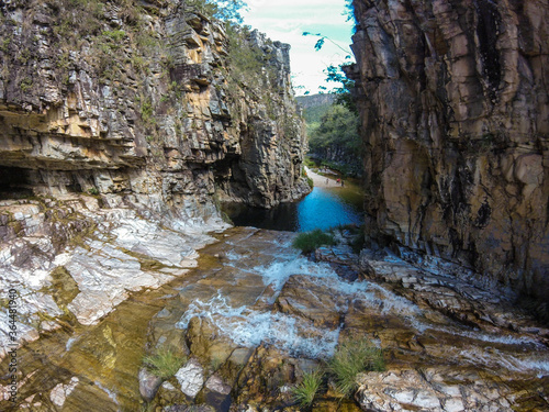 Fototapeta Naklejka Na Ścianę i Meble -  Large canyon with a small river running across the rocks at Serra da Canastra region in Brazil.