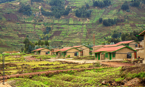 RWANDA: Model resettlement village to accommodate people from areas prone to floods and landslides. Houses have rainwater reservoirs, a biogas pit, and a home garden.  photo