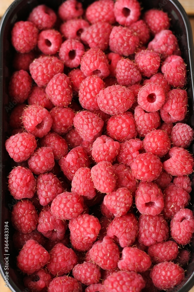 Delicious ripe raspberries on the market macro Delicious ripe raspberries on the market macro