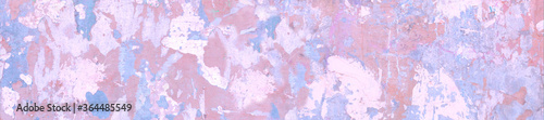 Panorama pink and light blue spots on cracked stucco.