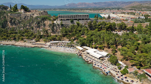 Aerial drone photo of famous beach of Arvanitia in the slopes of Acronafplia, Nafplio, Argolida, Peloponnese, Greece photo