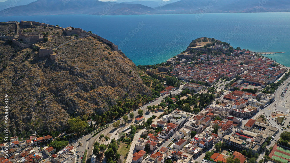 Aerial drone photo of picturesque and historic old town of Nafplio in the slopes of Palamidi fortress and Acronafplia, Argolida, Peloponnese, Greece