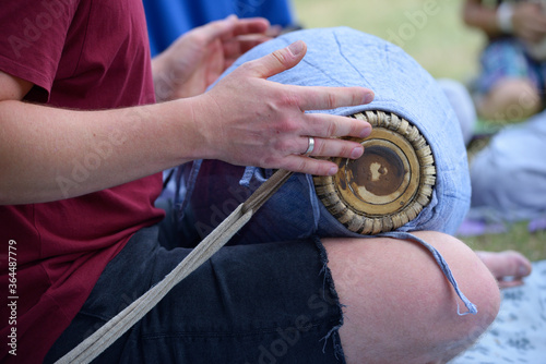 Musician hand playing Indian musical instrument Mridangam for meditation