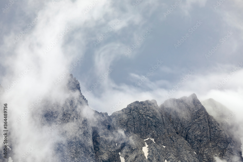 fog and clouds above mountain peaks