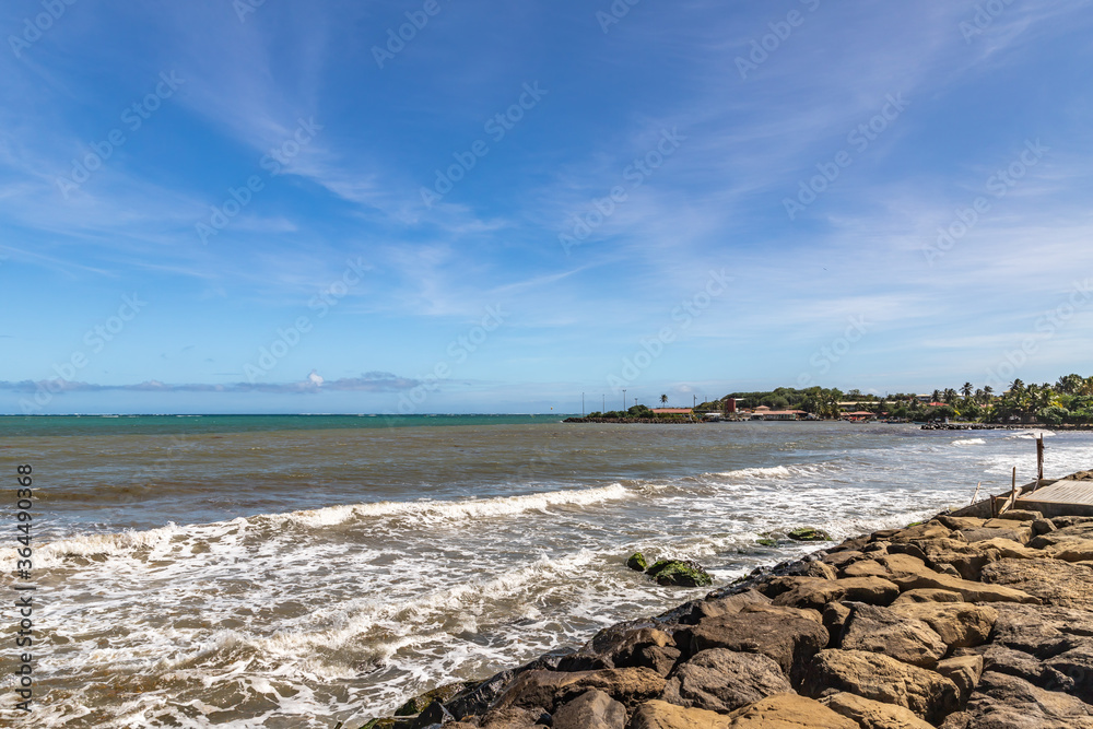 Shore line and muddy ocean water in Vauclin, Martinique, France Shore line and muddy ocean water in Vauclin, Martinique, France