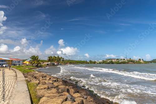 Shore line and muddy ocean water in Vauclin, Martinique, France