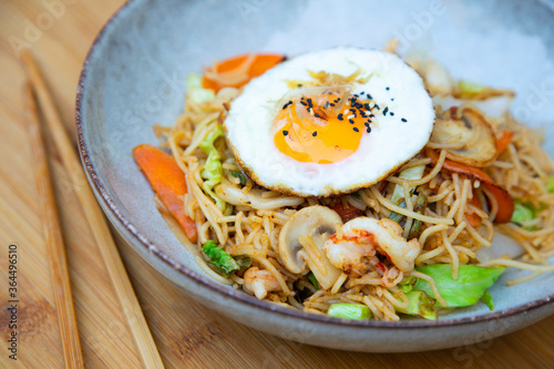 Yakisoba noddles with vegetables, seafood and egg