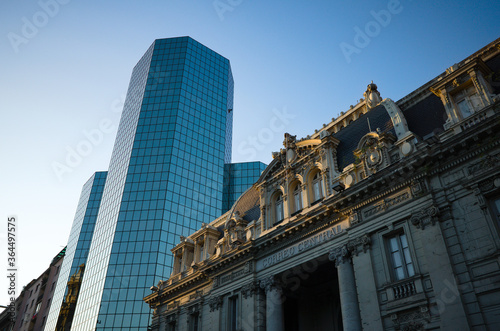 View from low angle view of building of National Historical Museum and new business office skyscraper in city cent re near Plaza de Armas square of Santiago, Chile. 