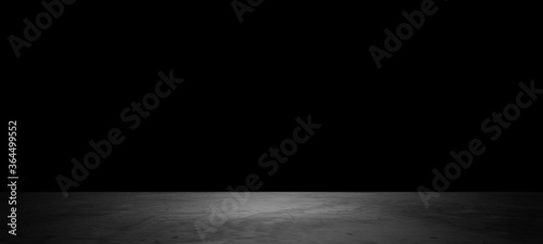 Dark background in front of grey empty stone concrete space for text modern look,interior texture for display products,wall background.