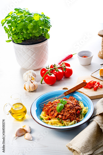 Delicious spaghetti bolognese on white background
