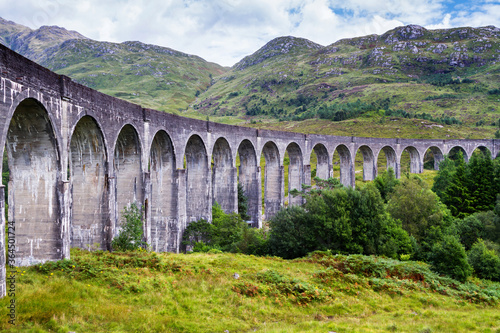 The Glenfinnan viaduct during summertime on the westcoast of Scotland, United Kingdom photo