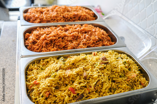 Nigerian Jollof and Vegetable Fried Rice served in Chaffing dish