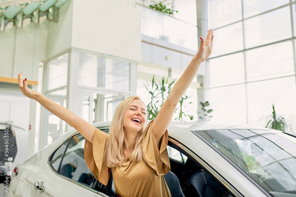 young blonde caucasian female want this car, she sits inside of comfortable car, enjoy. young blonde caucasian female want this car, she sits inside of comfortable car, enjoy.