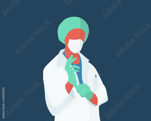 Surgeon in protective suit putting on medical gloves for protection.