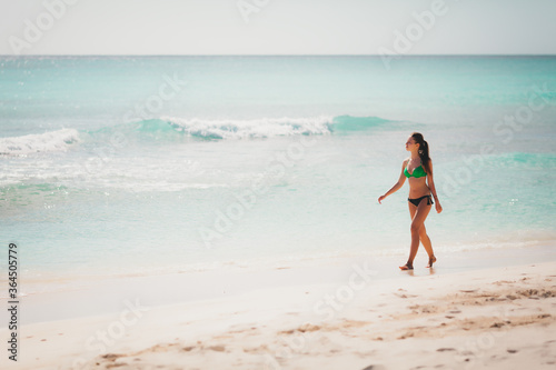 travel vacation wallpaper - Beautiful young pretty blonde girl in white bikini with white sand on her perfect sport sexy body relax in sea of white sand paradise tropical Maldives beach at sunny day