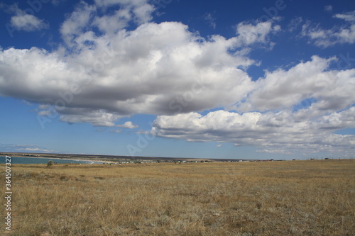 Blue sky and clouds over the steppes of the Crimea in the summer.