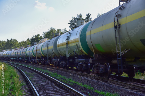 Transport tank car LNG by rail, gas - oil products. LPG transport propane. The fuel train, rolling stock with petrochemical tank cars. Liquefied natural gas export.