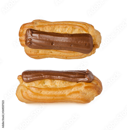 Isolated two eclairs with custard and chocolate icing on white background. Traditional french dessert. Sweet pastry  food