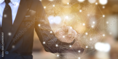 Fototapeta Naklejka Na Ścianę i Meble -  Businessman hands touching point network connection on blurred background. Wireless connect futuristic concept. Elements of this image furnished by NASA